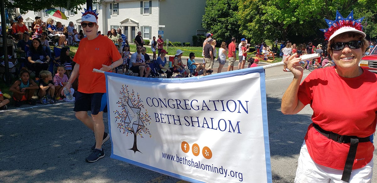 Beth Shalom congregants carrying a banner at a parade