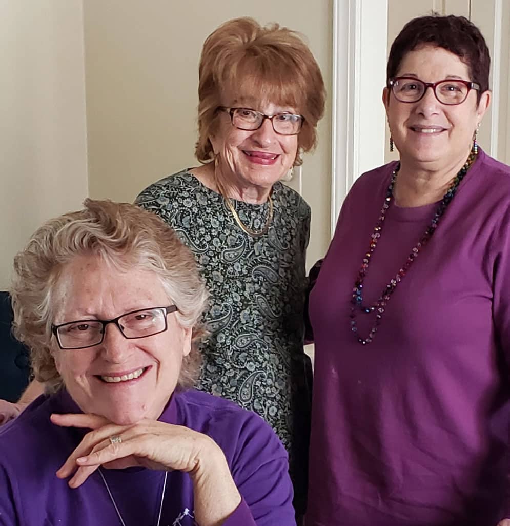 three older women smiling